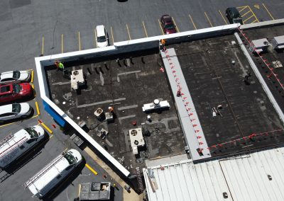 Workers Repairing a Commercial Roof