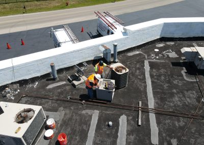 Servicing HVAC units on a flat commercial roof