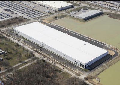 Large commercial building with new white roof