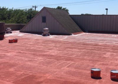 Red flat roof getting sealed