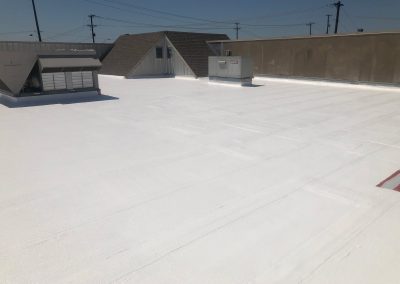 White roof coating on commercial roof