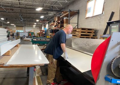 Worker cutting roof panels